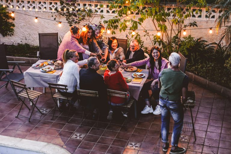 Happy,Family,Eating,And,Cheering,With,Red,Wine,At,Barbecue